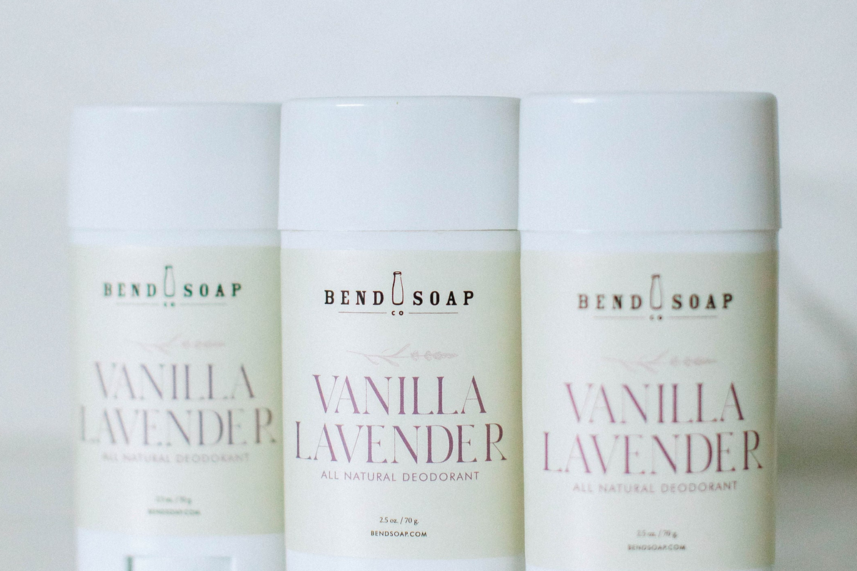 Three sticks of Bend Soap vanilla lavender all-natural deodorant are lined up side by side against a plain white background. The product labels are light-colored with simple, elegant text.