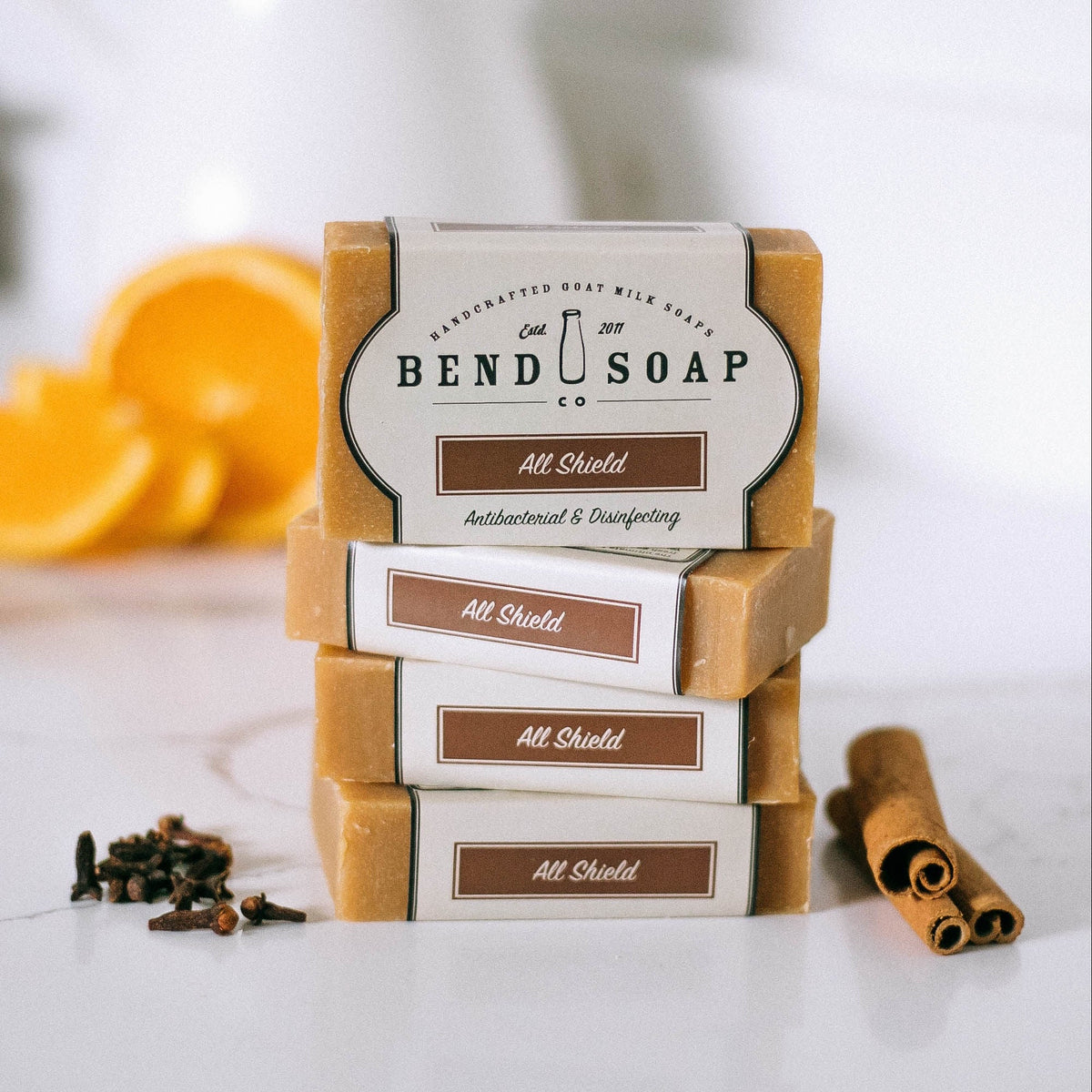 stack of all shield goat milk soap bars