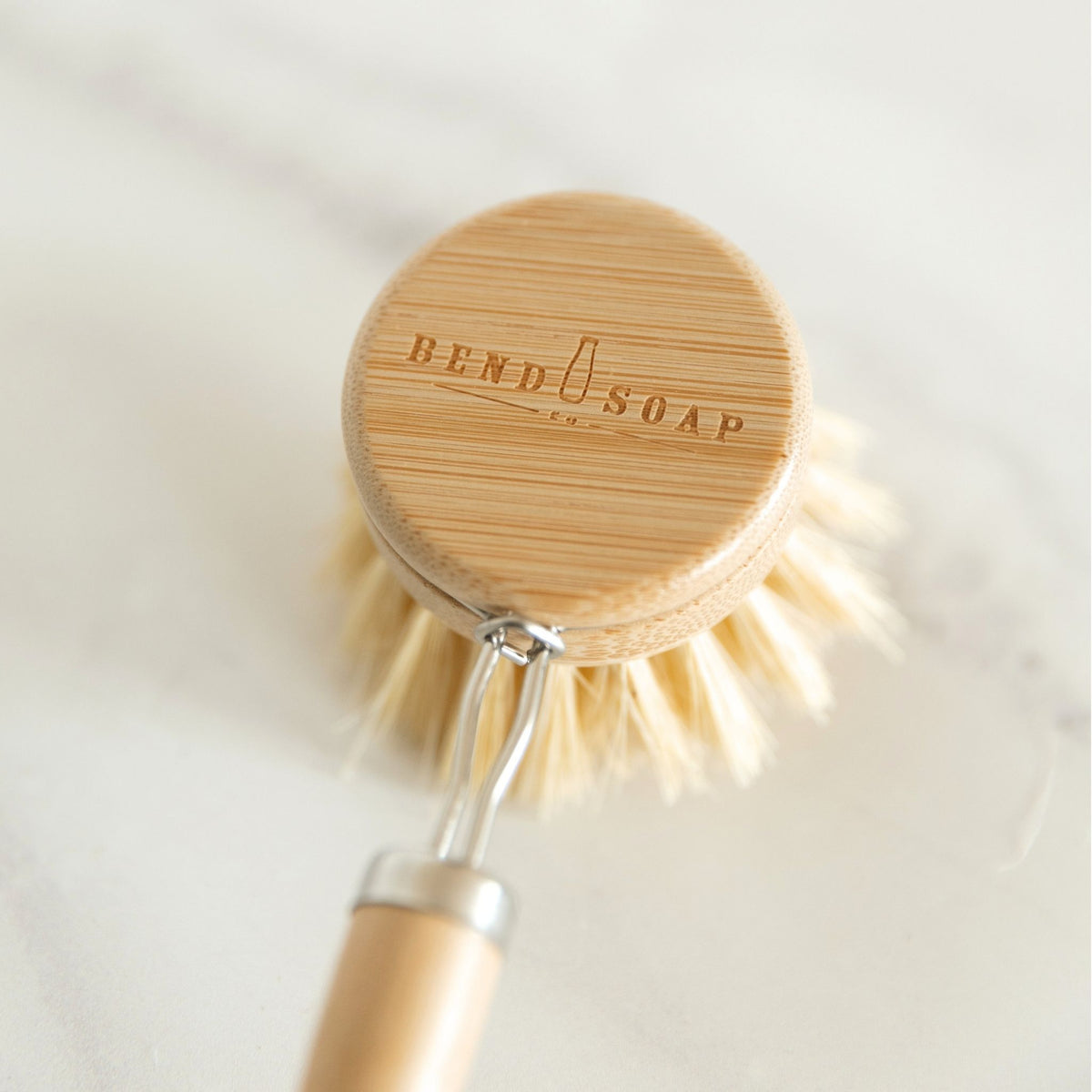 Long Handle Dish Brush with Bend Soap logo