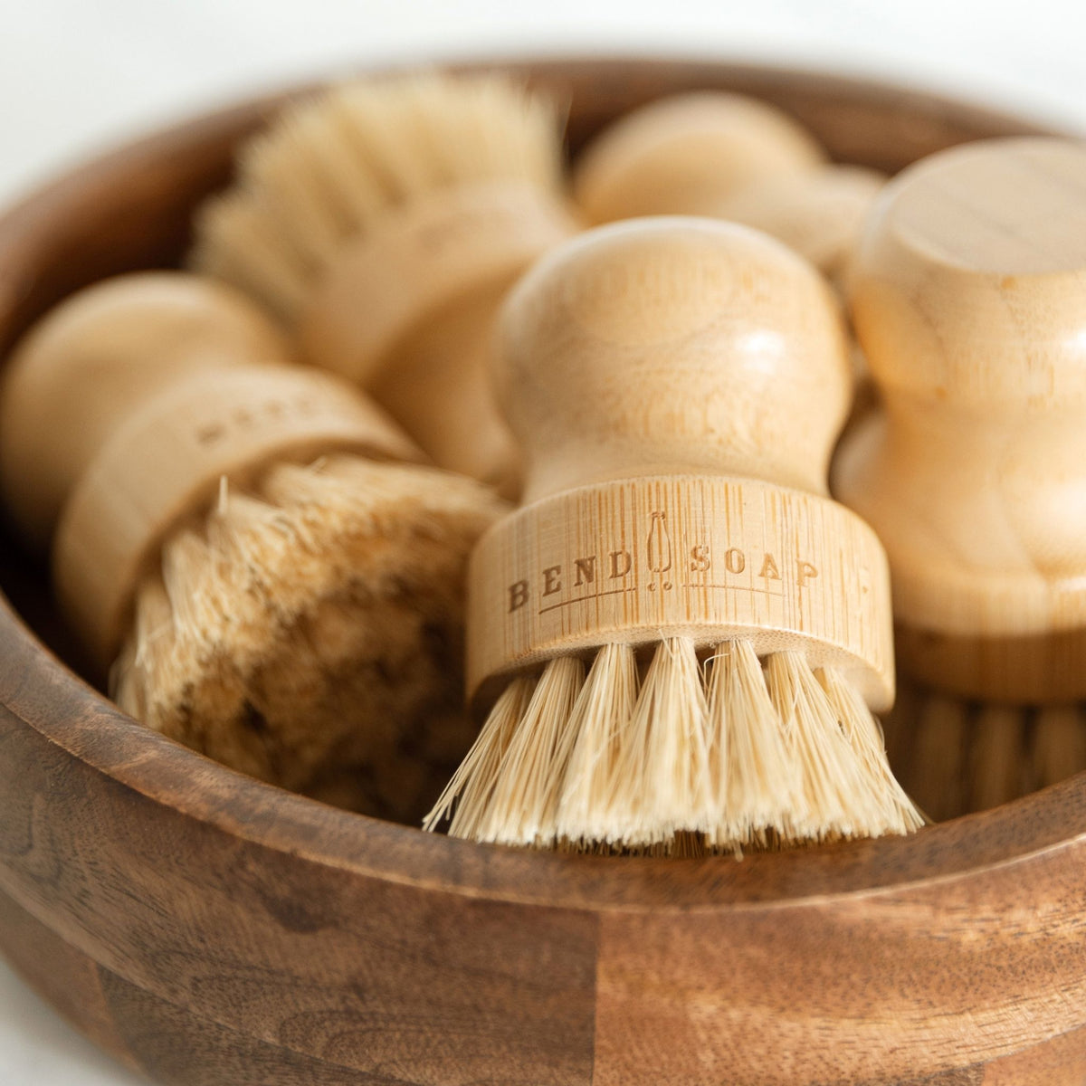 Wooden Palm Brush with the Bend Soap logo